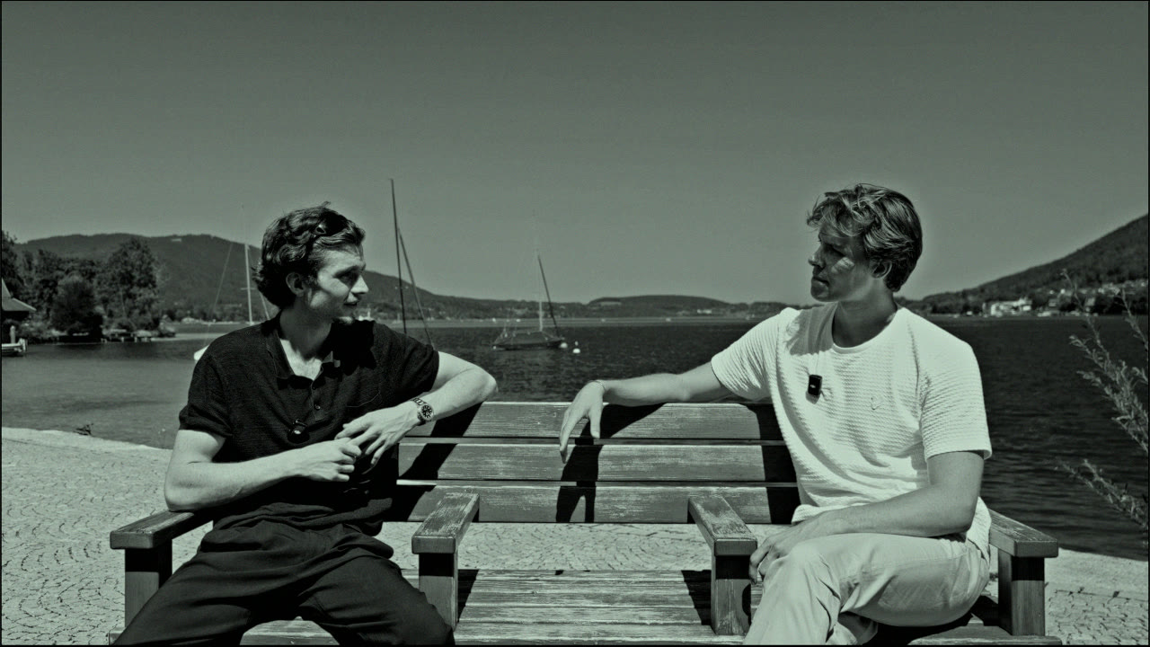 Elias and Sean on a lakeside bench